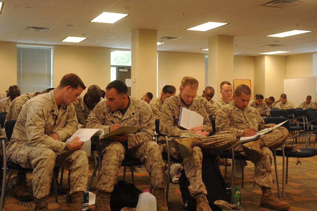 Marines take a test in completion of a chaser course at Yale Hall aboard Marine Corps Base Quantico on May 6, 2013. Chasers are certified Marines who work with various types of people including those going to and from the brig.