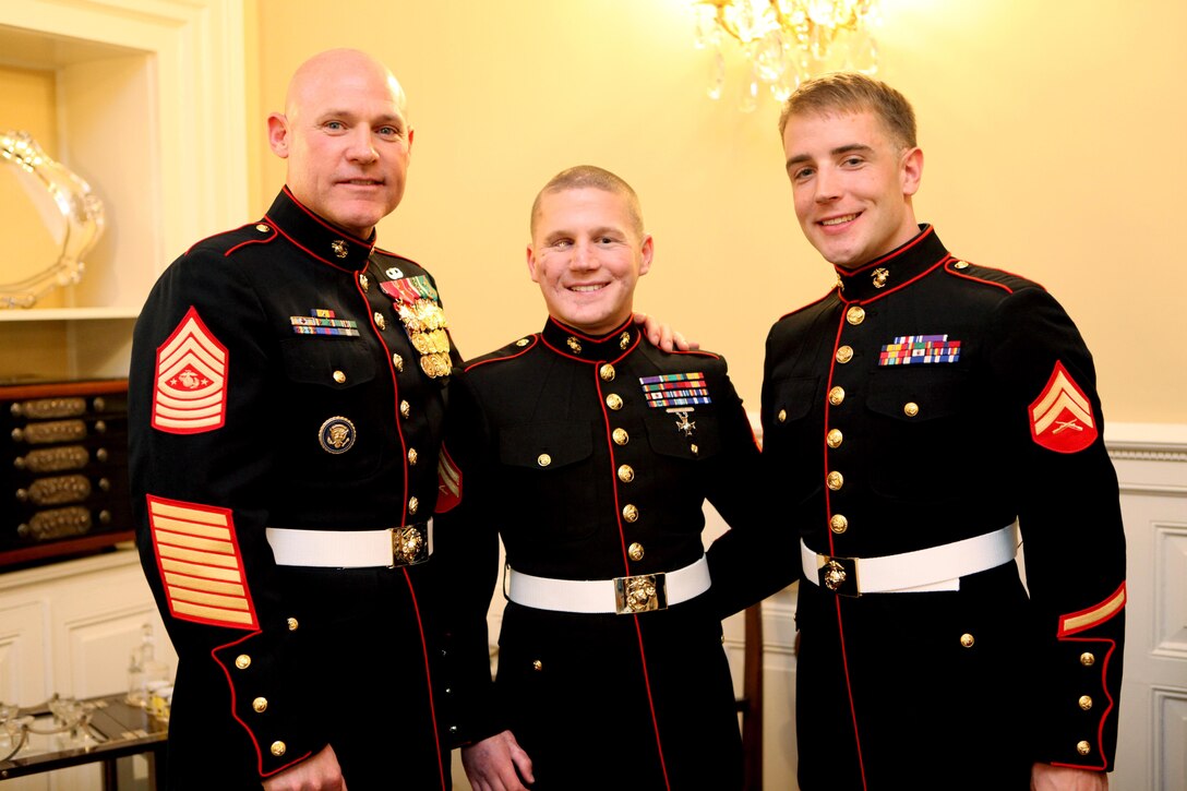 Sgt. Maj. Micheal P. Barrett, the 17th Sergeant Major of the Marine Corps, Cpl. Kyle Carpenter and another wounded warrior during a reception at The Home of the Commandants in Washington, D.C., on May 3, 2013. (U.S. Marine Corps photo by Sgt. Marionne T. Mangrum)