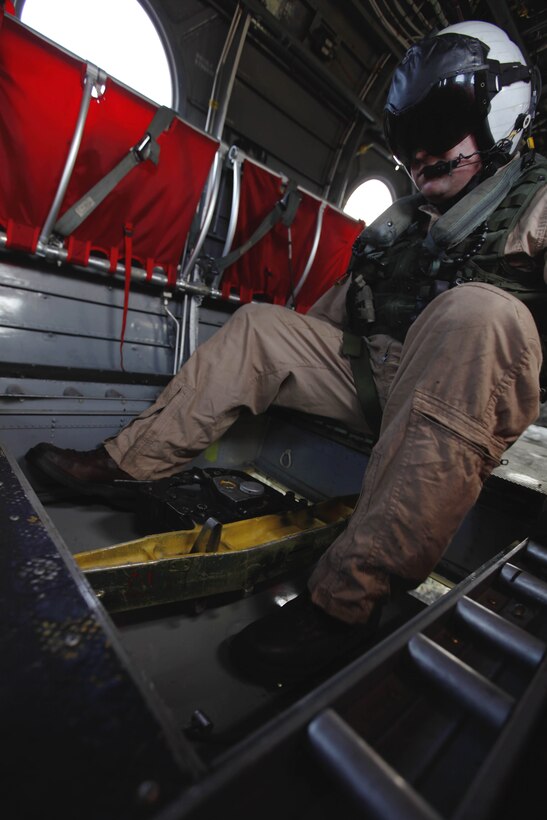 Staff Sgt. Brian Dinning closes the hitch hatch during the 6th annual aerial wildland fire fighting exercise here May 9. Dinning is a crew chief with Marine Medium Helicopter Training Squadron-164 with the air station here.