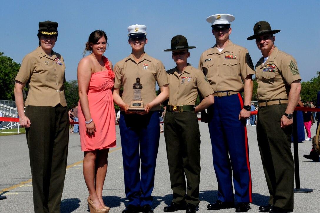 Private First Class Jennica A. Garitty, honor graduate of platoon 4014, stands with Brig. Gen. Loretta E. Reynolds, Commanding General of Marine Corps Recruit Depot, Parris Island, and her family after graduation aboard Parris Island, S.C., May 10, 2013.Garitty is a native of New Orleans, La., and recruited  by Staff Sgt. John P. Allison, recruiter from RSS Bowling Green . Garrity will be able to enjoy some much deserved leave as she prepares for Marine Combat Training in Camp Geiger, N.C. (U.S. Marine Corps photo by Pfc. Stanley Cao)