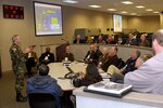 Participants in a civic leader tour hosted by the North American Aerospace Defense Command and U.S. Northern Command visit the NORAD-USNORTHCOM Command Center at Peterson Air Force Base.