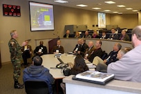 Participants in a civic leader tour hosted by the North American Aerospace Defense Command and U.S. Northern Command visit the NORAD-USNORTHCOM Command Center at Peterson Air Force Base.