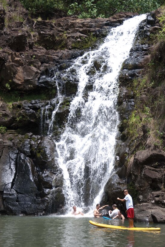 HALEIWA, Hawaii — Visitors enjoy the water at the base of Waimea Falls in Haleiwa, April 28. Waimea Valley is filled with 1,875 acres of plant life, bodies of water and wildlife. (U.S. Marine Corps photo by Lance Cpl. Janelle Y. Chapman) 