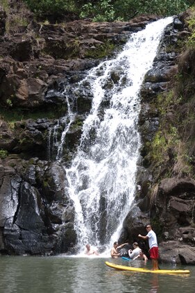 HALEIWA, Hawaii — Visitors enjoy the water at the base of Waimea Falls in Haleiwa, April 28. Waimea Valley is filled with 1,875 acres of plant life, bodies of water and wildlife. (U.S. Marine Corps photo by Lance Cpl. Janelle Y. Chapman) 