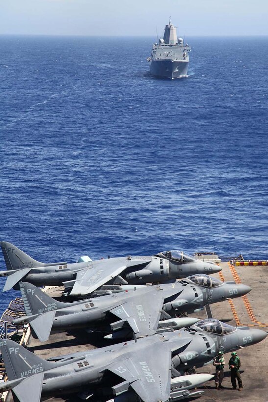 USS Green Bay follows behind USS Peleliu during an air-power display over the Pacific Ocean, May 9. During the last leg of the deployment, guests came aboard both ships to experience ship-life and to learn what their Marine or sailor has accomplished during the past seven months. The 15th Marine Expeditionary Unit is comprised of approximately 2,400 Marines and sailors and is deployed as part of the Peleliu Amphibious Ready Group. Together, they provide a forward-deployed, flexible sea-based Marine Air Ground Task Force capable of conducting a wide variety of operations ranging from humanitarian aid to combat. (U.S. Marine Corps photo by Cpl. Timothy Childers / Released)