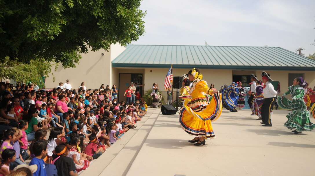 Marines from Marine Attack Squadron 211, based out of Marine Corps Air Station Yuma, watched their adopted students at George Carver Elementary school perform traditional Mexican heritage performances as part of their end of the school year Cinco De Mayo bash, May 3. The students wore intricate, colorful floral dresses and performed traditional dance sequences in front of a crowd of faculty, family, friends, and their Marine mentors. 