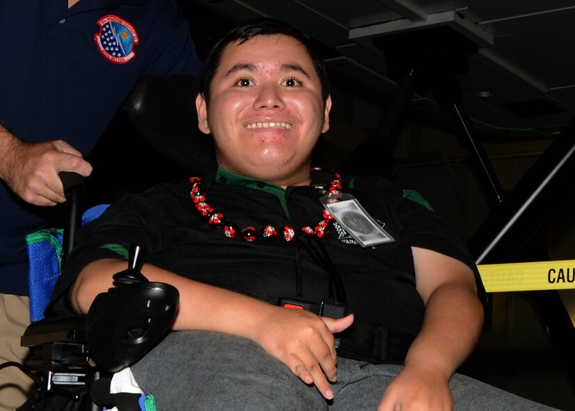 Damon Hall-Kaneakua, a 16-year-old battling with Duchenne muscular dystrophy
toured the 15th Wing May 3 as a participant in the Pilot for a Day program.
Hall-Kaneakua brought along his mother, grandparents, three sisters and
brother. (U.S. Air Force photo/Tech. Sgt. Phyllis E. Keith)