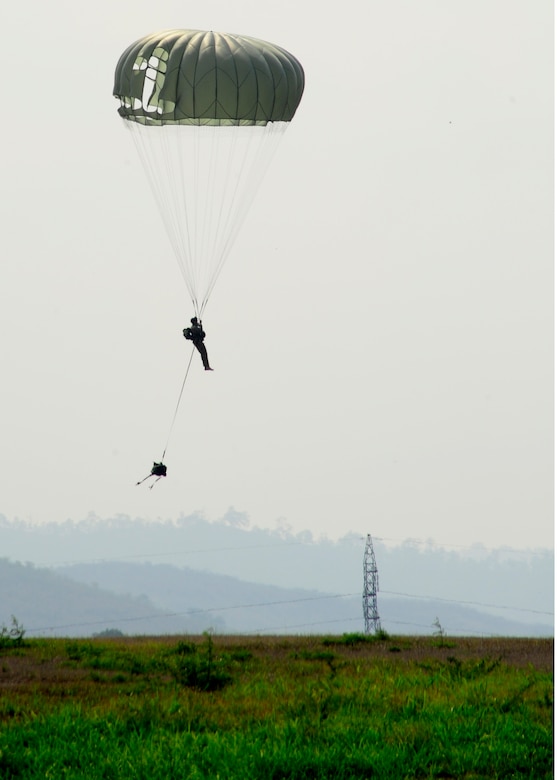 A U.S. Army paratrooper makes a safe landing after a successful static line proficiency training jump from a UH-60 Blackhawk at Soto Cano Air Base, Honduras, April 30. The paratroops must make a minimum of 4 jumps a year to stay proficient. (Air Force photo by Staff Sgt. Eric Donner)