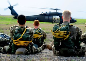 U.S. Army paratroopers wait for their turn during a static line proficiency training jump at Soto Cano Air Base, Honduras, April 30. The paratroops must make a minimum of 4 jumps a year to stay proficient. (Air Force photo by Staff Sgt. Eric Donner) 