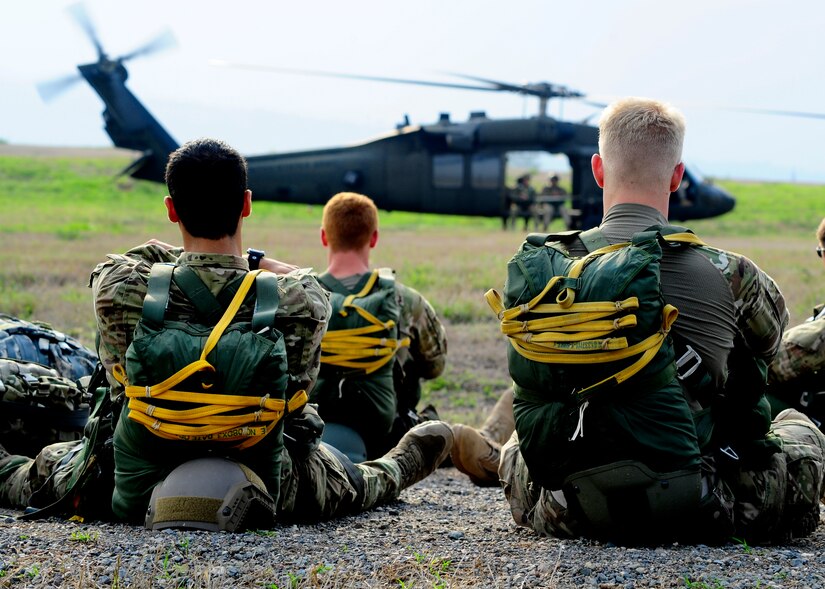 U.S. Army paratroopers wait for their turn during a static line proficiency training jump at Soto Cano Air Base, Honduras, April 30. The paratroops must make a minimum of 4 jumps a year to stay proficient. (Air Force photo by Staff Sgt. Eric Donner) 