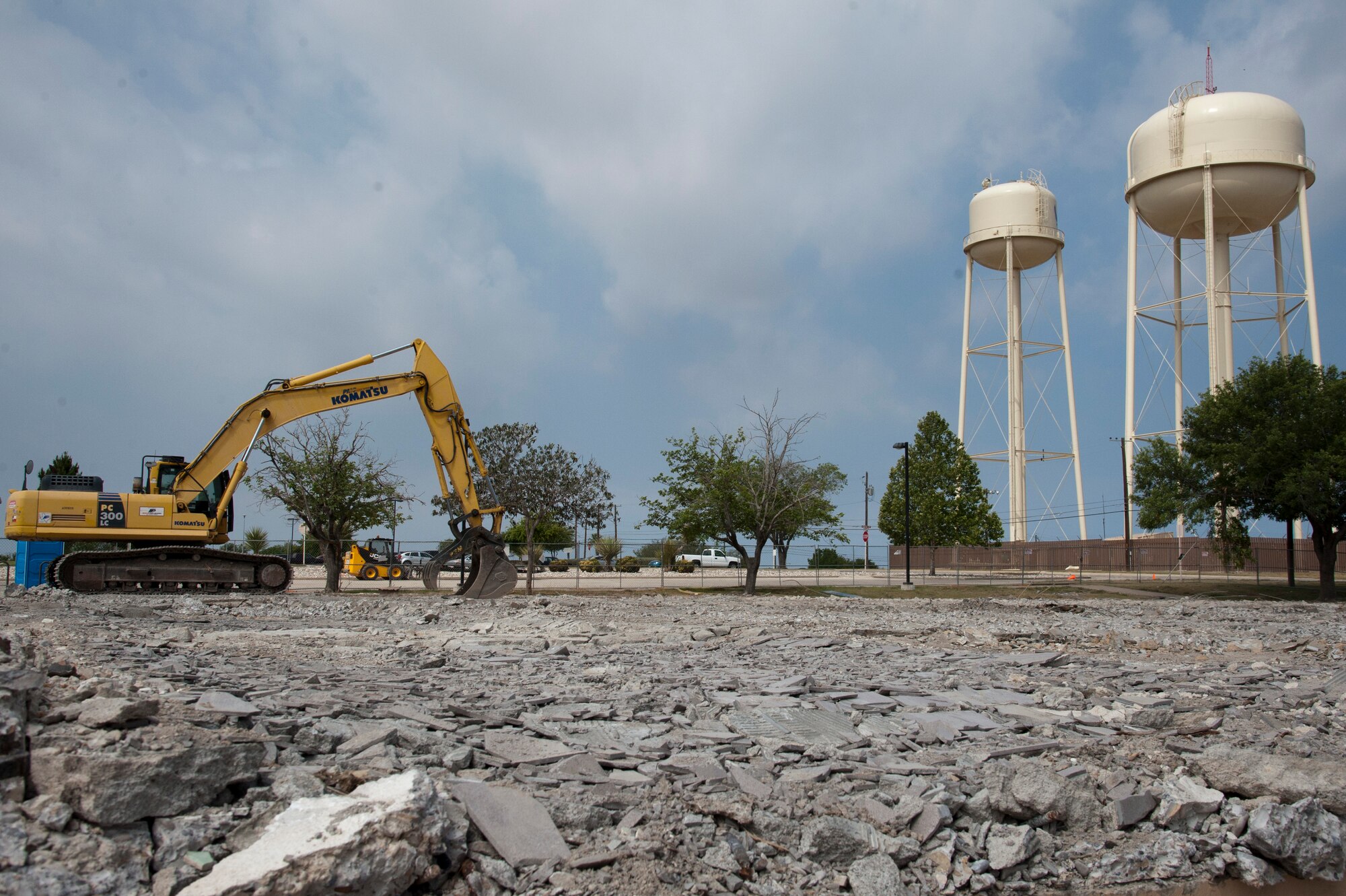Little remains of building 358, the base’s old fitness center, after construction crews demolished and cleared the site of rubble at Laughlin Air Force Base, Texas, May 10, 2013. The old fitness center was replaced by a new facility, and the decision was made to destroy the old gym as part of the Air Force’s goal of reducing overall utilities and maintenance costs by 20 percent by the year 2020. Laughlin has selected 24 buildings, whose original work centers can be consolidated elsewhere, for demolition, saving $377,000 annually as part of the cost conscious culture. (U.S. Air Force photo/Airman 1st Class Jimmie D. Pike)