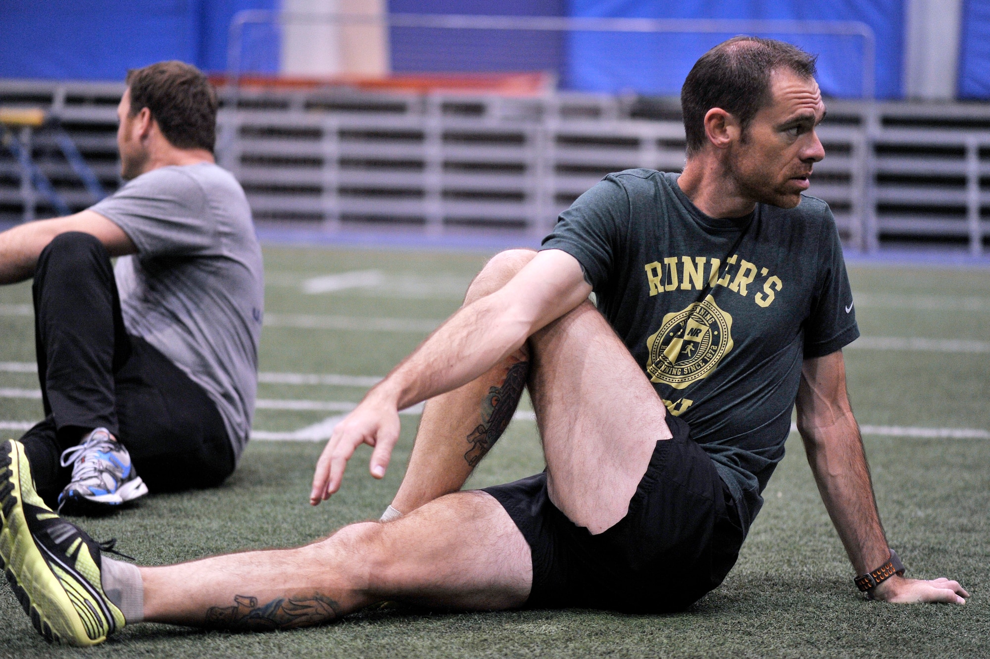 Master Sgt. Shawn Schwantes stretches out before running laps at the Academy indoor track during the Wounded Warrior Games training camp held in Colorado Springs, Colo., April 18, 2013. Schwantes is stationed at Joint Base San Antonio-Lackland. (U.S. Air Force photo/Desiree N.Palacios)