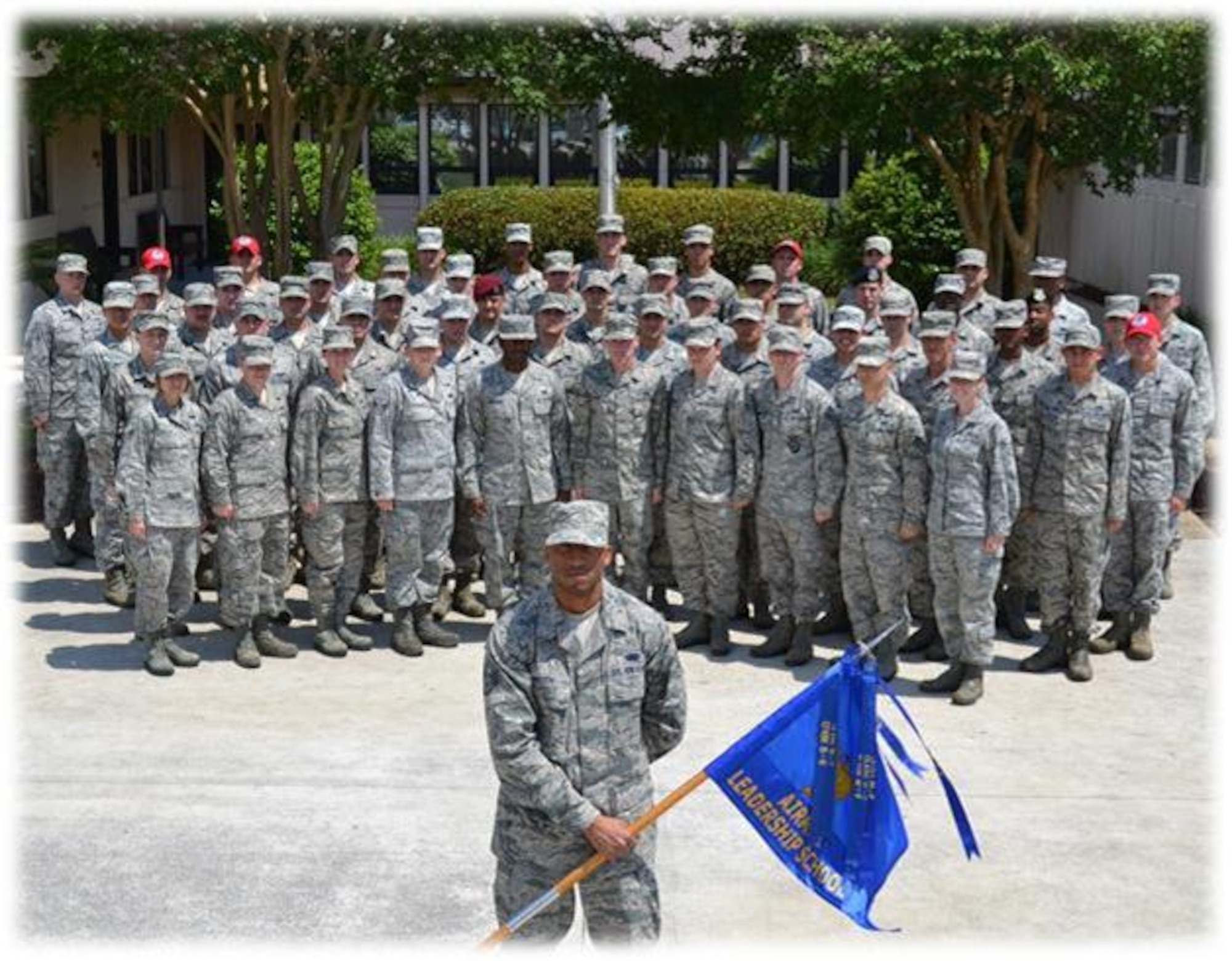 Staff sergeants and senior airmen from Class 13-D of the Vincent Airman Leadership School pose in front of the school at Hurlburt Field, Fla. The class graduated from ALS during a ceremony at the Soundside Club at Hurlburt Field, Fla., May 9, 2013. (Courtesy photo)