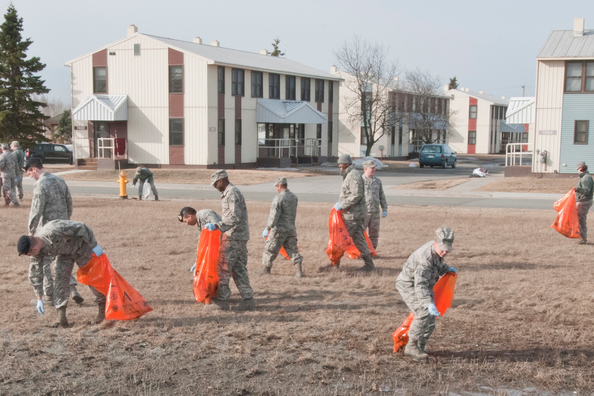 JOINT BASE ELMENDORF-RICHARDSON, Alaska -- 176 Wing members clean around their work building May 6 as part of the base's Spring Cleanup. Air guardsmen of all ranks helped in the effort.  National Guard photo by Staff Sgt. N. Alicia Goldberger.