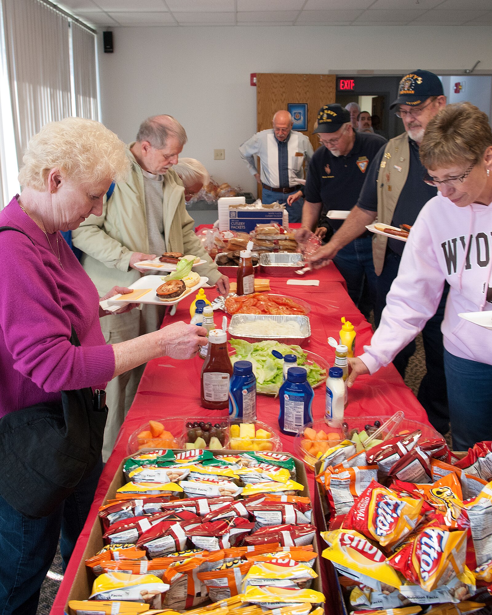 Retiree appreciation day attendees help themselves to hamburgers, hot dogs and fixings in the 90th Medical Group clinic, F. E. Warren Air Force Base, May 4. (U.S. Air Force photos by R.J. Oriez)