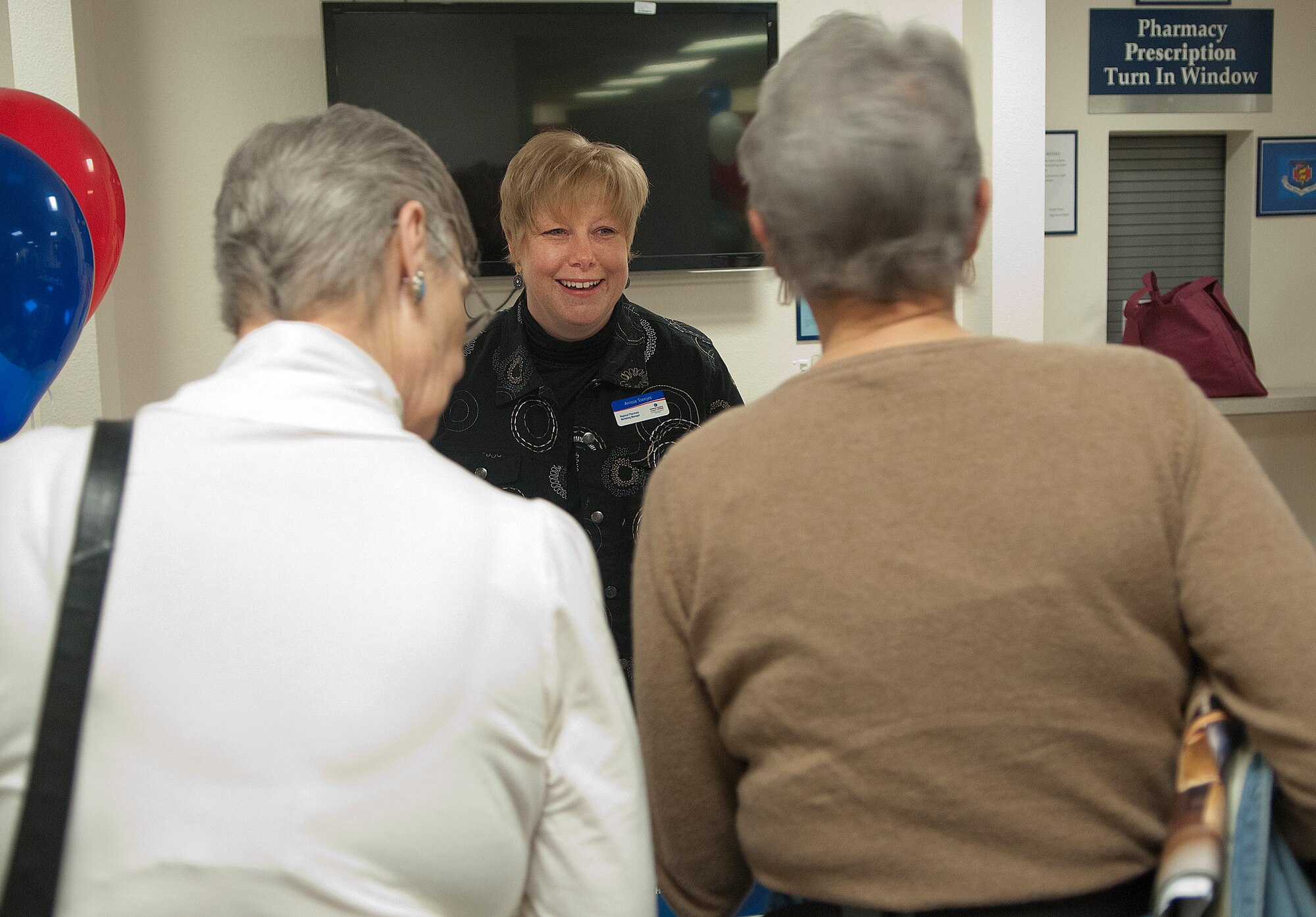 Anissa Toenjas, Express Scripts regional pharmacy marketing manager, talks with military retirees May 4, about the service her organization provides. Toenjas was at the base clinic taking part in the base’s annual Retiree Appreciation Day. (U.S. Air Force photos by R.J. Oriez) 