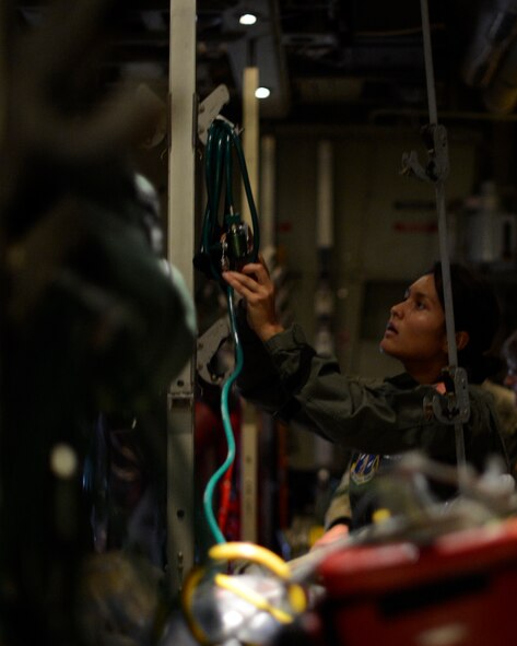 Senior Airman Danielle Cooper, 109th Aeromedical Evacuation Squadron, performs a pre-flight equipment check in St. Paul, Minn., May 8, 2013. Cooper is a Medical Service Technician who is responsible for checking vital signs and giving medical attention if needed. 
(U.S. Air Force photo by Tech. Sgt. Amy M. Lovgren/Released) 
 
