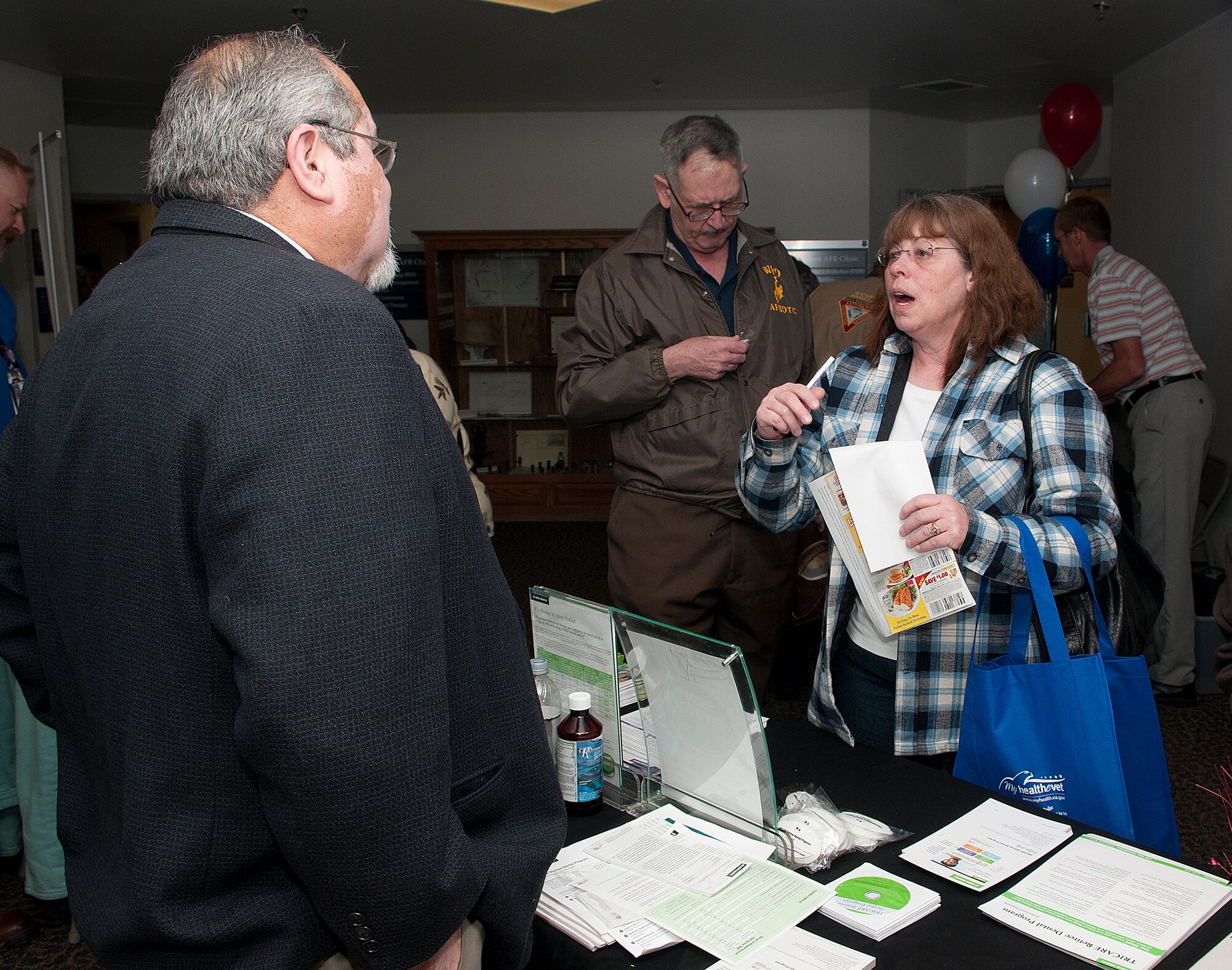 Sharon Anderson talks with Joe Montoya, Delta Dental marketing representative, during the F. E. Warren Air Force Base Retiree Appreciation Day May 4. Anderson is the spouse of a retired military member. (U.S. Air Force photos by R.J. Oriez) 