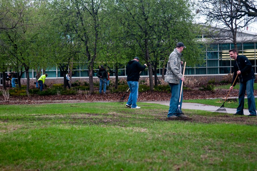 Airmen of the 133rd Airlift Wing and employees of the State of Minnesota team together, after a long winter, to clean up the base at St. Paul Minn., May 09, 2013. 
(U.S. Air Force photo by Staff Sgt. Austen Adriaens/released) 
