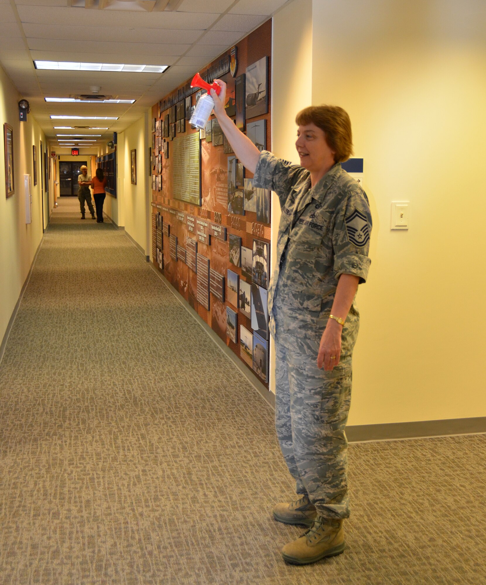 WRIGHT-PATTERSON AIR FORCE BASE, Ohio - Senior Master Sgt. Karen Miller, 445th Airlift Wing Command Post superintendent, sounds the air horn to alert wing staff members during a practice active shooter exercise in building 4010 April 6. (U.S. Air Force photo/Stacy Vaughn)