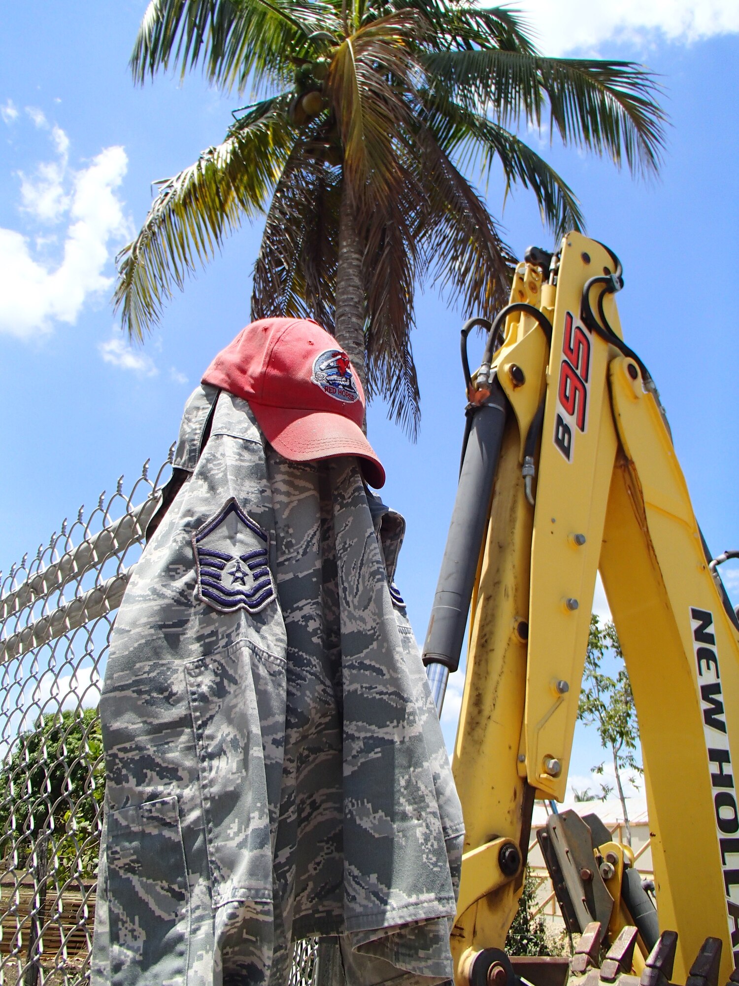 An Airman’s uniform blouse hangs on a fence at the construction site of Crooked Tree Government Primary School in Belize. (U.S. Air Force photo/Senior Master Sgt. Joel Shepherd)