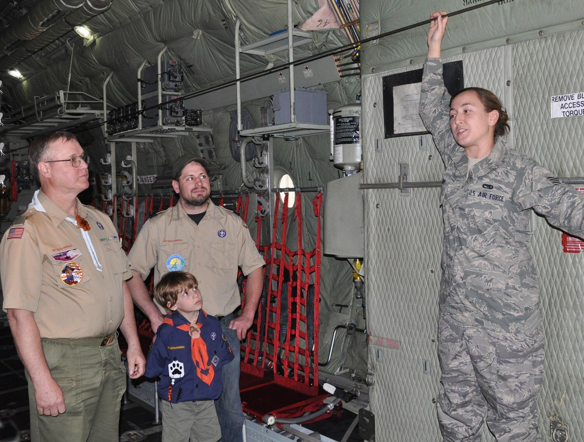 Air Force Staff Sgt. Jacqueline Weems, a C-130 Crew Chief with the 910th Airlift Wing, leads a tour of the aircraft here, May 8, 2013.   