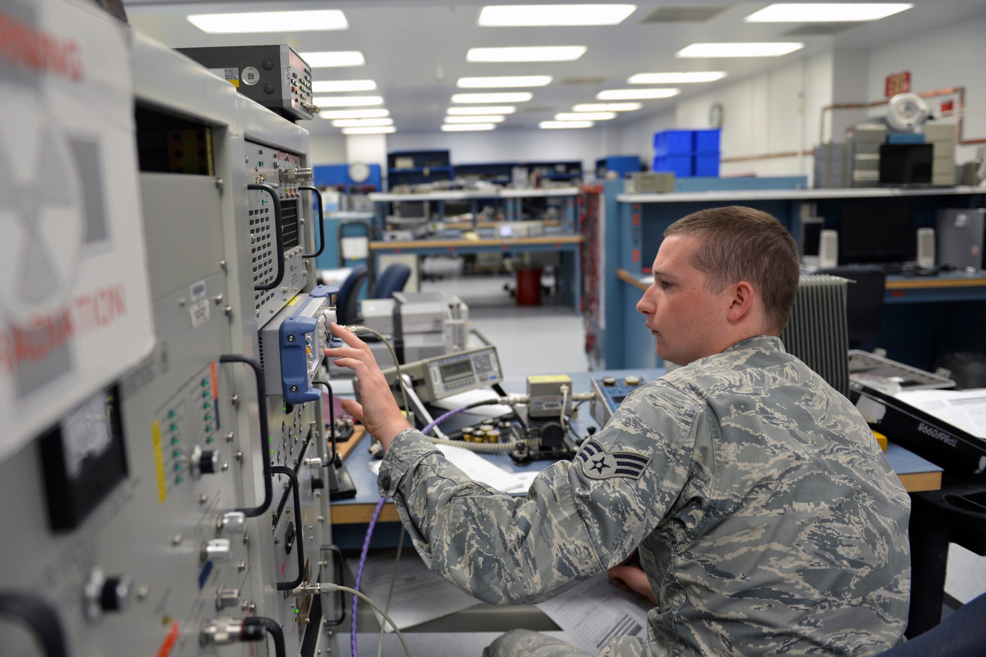 Senior Airman Jacob Burns, 62nd Maintenance Squadron Test Measurement Diagnostic Equipment Flight metrology technician, adjusts the frequency on a signal generator while calibrating a directional wattmeter May 8, 2013 at Joint Base Lewis-McChord, Wash. The TMDE flight is one of the only flights that has a wattmeter counsel capable of measuring up to 1,000 watts, as little as two megahertz and up to one gigahertz. (U.S. Air Force photo/Airman 1st Class Jacob Jimenez)