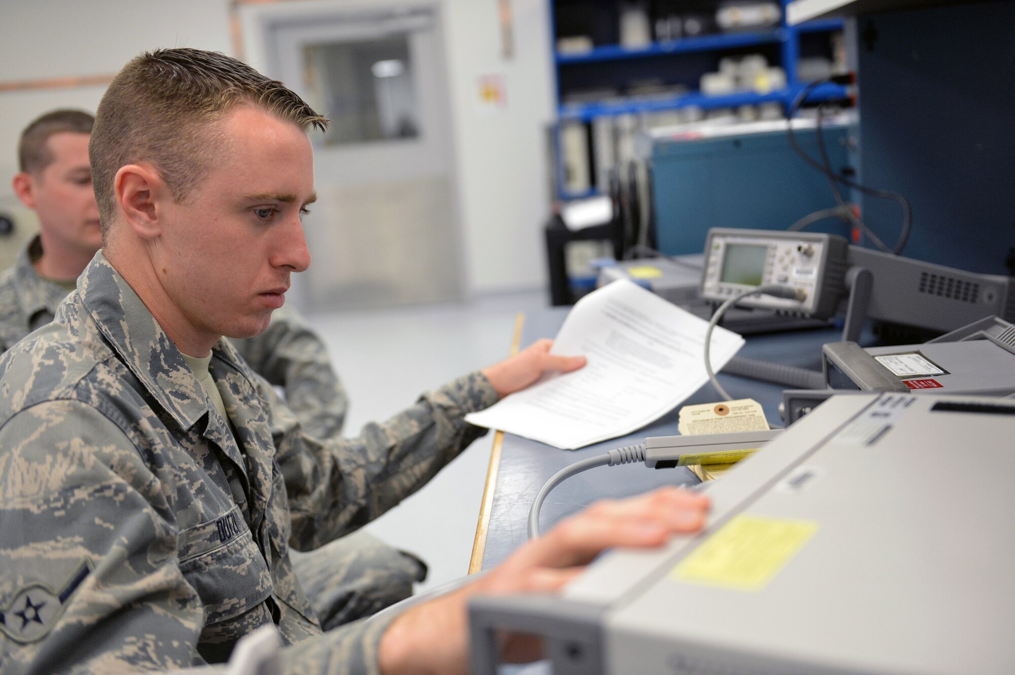 Airman Nathan Dutzi, 62nd Maintenance Squadron Test Measurement Diagnostic Equipment Flight metrology technician, calibrates a counter May 2, 2013 at Joint Base Lewis-McChord, Wash. The TMDE flight uses, aligns, troubleshoots and calibrates equipment in the areas of voltage, current, power, impedance, frequency, temperature, humidity, length, mass and radiation equipment. (U.S. Air Force photo/Airman 1st Class Jacob Jimenez)