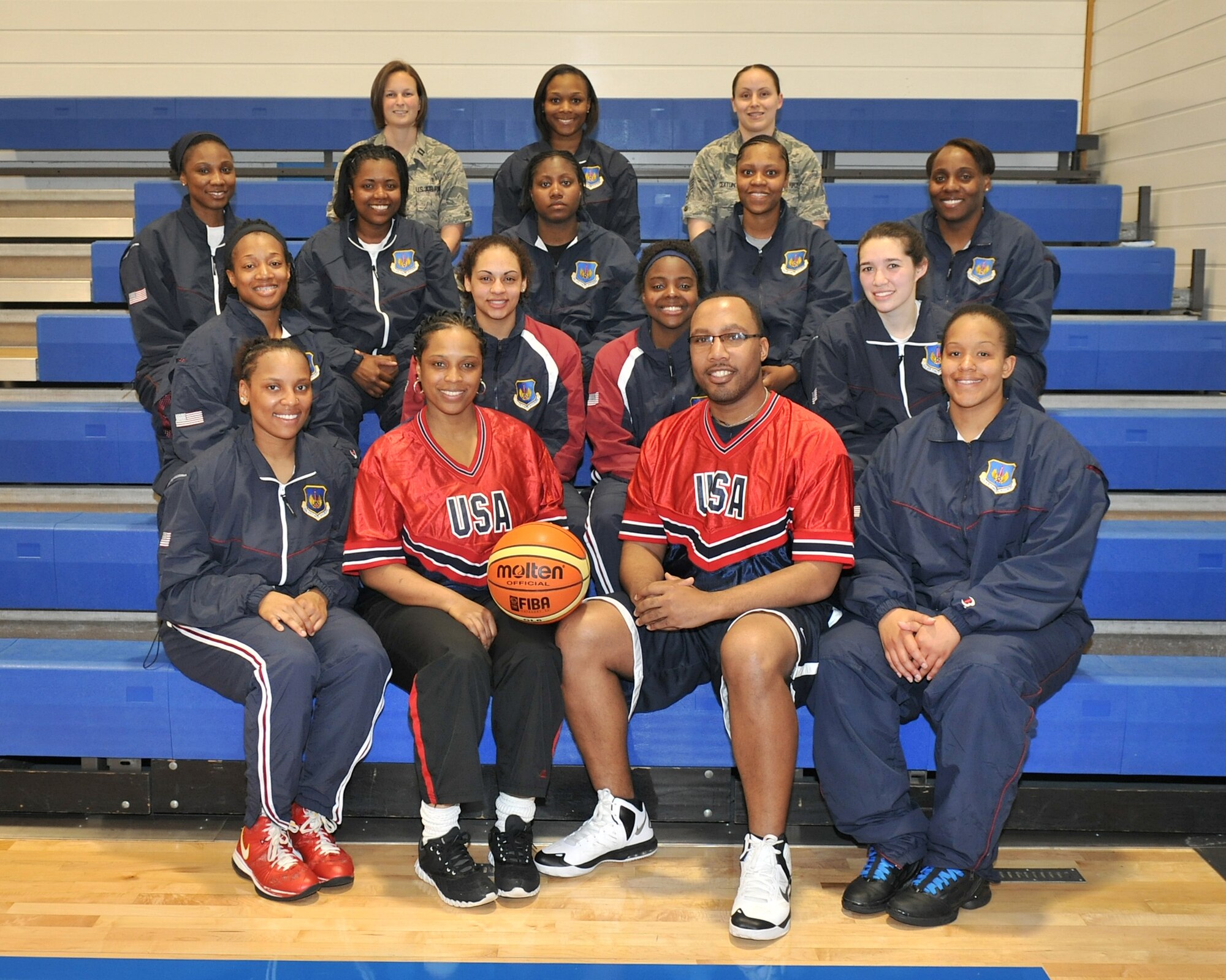 Airmen from the United States Air Forces in Europe women’s basketball team pose for a group photo during their last training day May 9, 2013, at the gymnasium on RAF Lakenheath, England. Comprised of Airmen from various bases in USAFE, the players will compete against the air forces of other nations including Belgium, Germany, United Kingdom, the Netherlands and Poland. (U.S. Air Force photo by Senior Airman Jerilyn Quintanilla/Released)