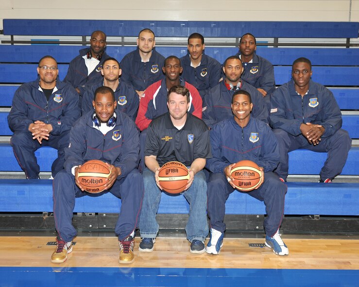 Airmen from the United States Air Forces in Europe men’s basketball team pose for a group photo during their last training day May 9, 2013, at the gymnasium on RAF Lakenheath, England. The men’s and women’s teams are comprised of both officers and enlisted Airmen from various bases in USAFE chosen to represent the command in this year’s Inter-Nation Sports Championship games. (U.S. Air Force photo by Senior Airman Jerilyn Quintanilla/Released)