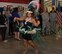 Rosalie Crain, Air Force Reserve Command secretary, preforms a Tahitian dance during the Asian Pacific American Heritage Month proclamation ceremony at the Exchange. ( U. S. Air Force photo by Misuzu Allen/Released)