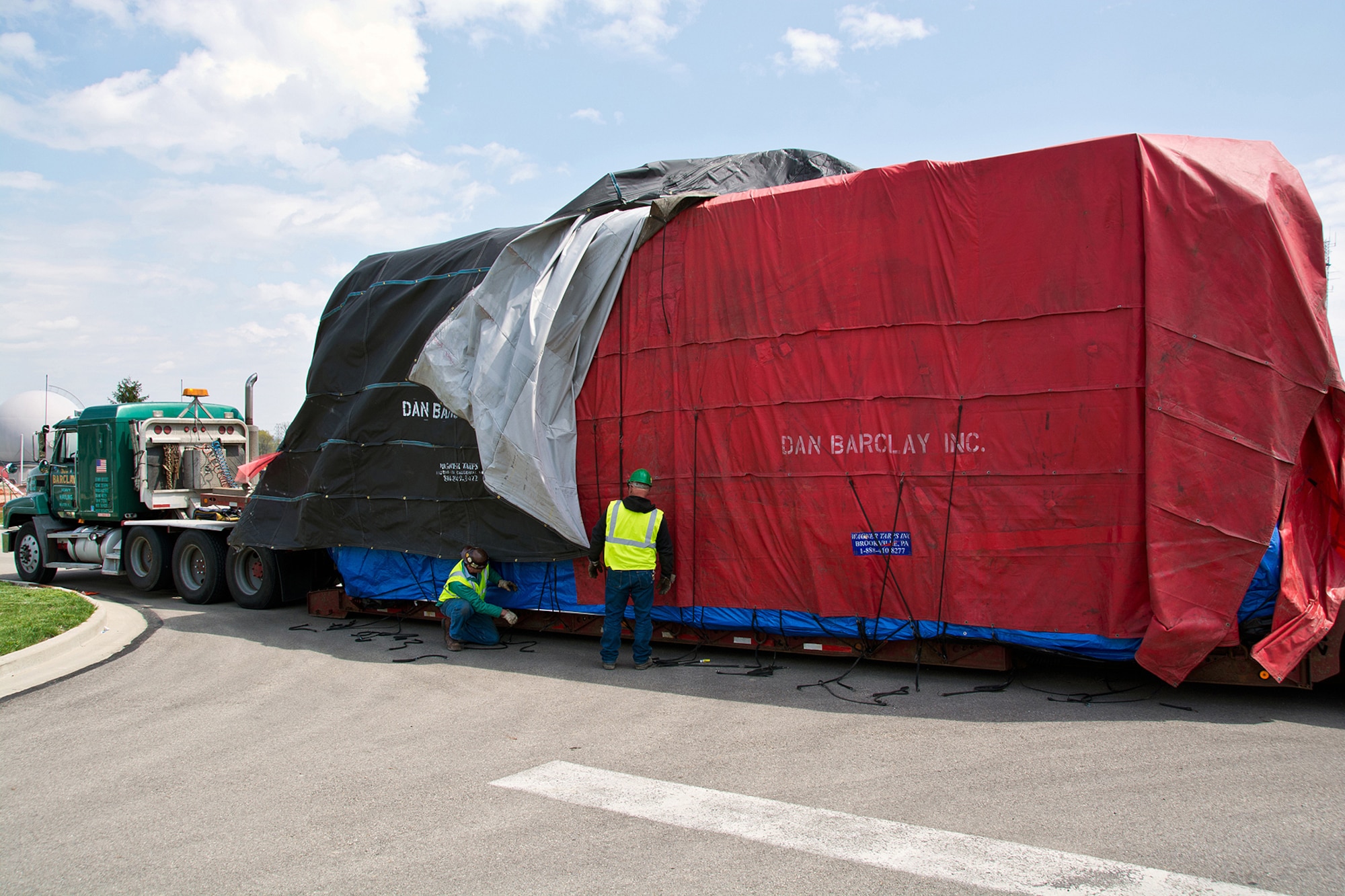 Tarps that covered the Research Altitude Chamber en route are removed.  Photo credit: Mr. Rick Eldridge.
