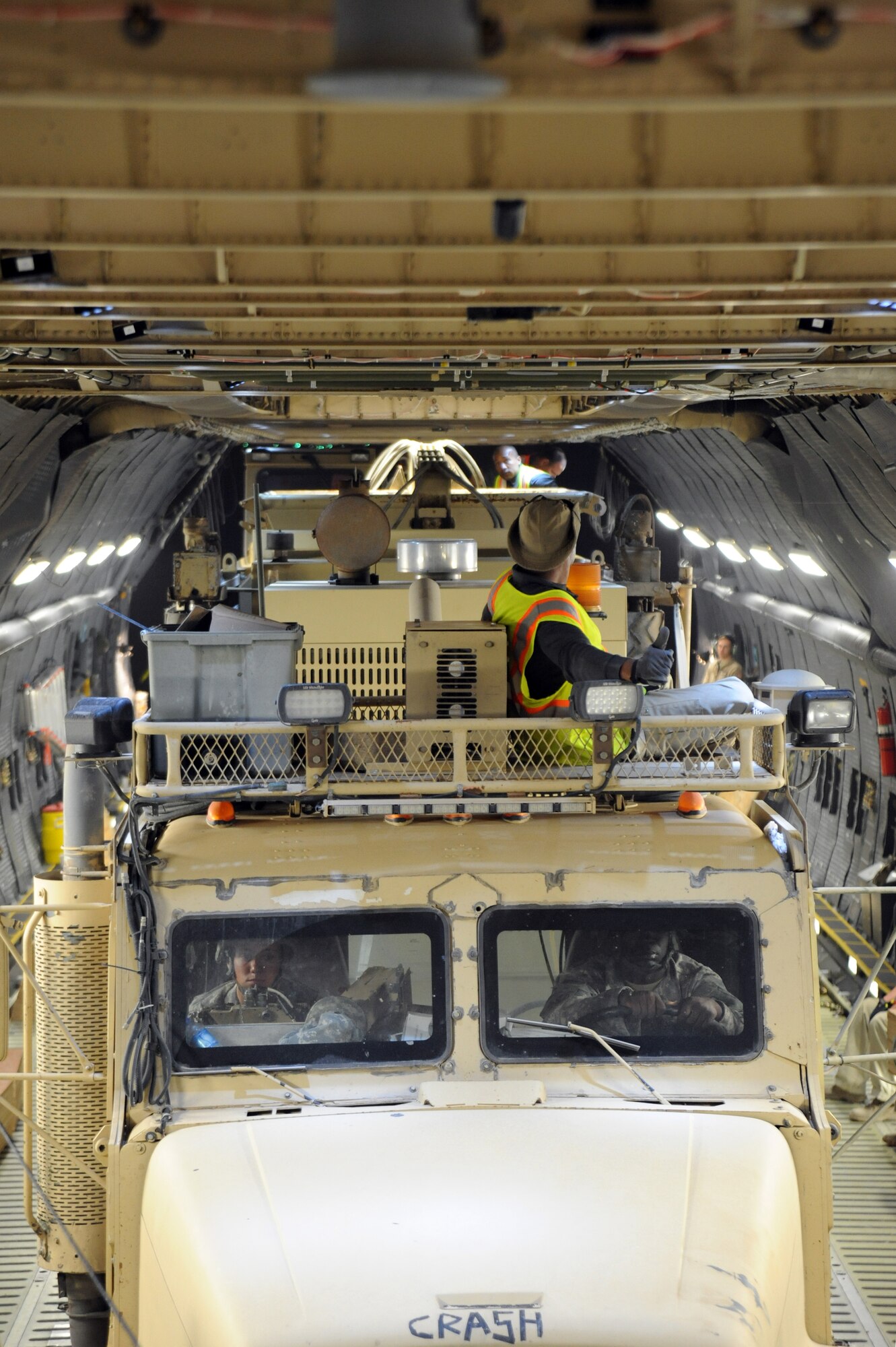 The 87,000 pound Granutech Mobile Rotogrind Shredder Model 525 HP is slowly rolled into an Air Mobility Command C-5M Super Galaxy based out of Dover Air Force Base, Del., May 8, 2013 at an undisclosed airfield, Southwest Asia. The shredder had 6 inches of clearance from the top of the cargo bay once fully loaded into the aircraft. (U.S. Air Force photo/Senior Master Sgt. George Thompson)