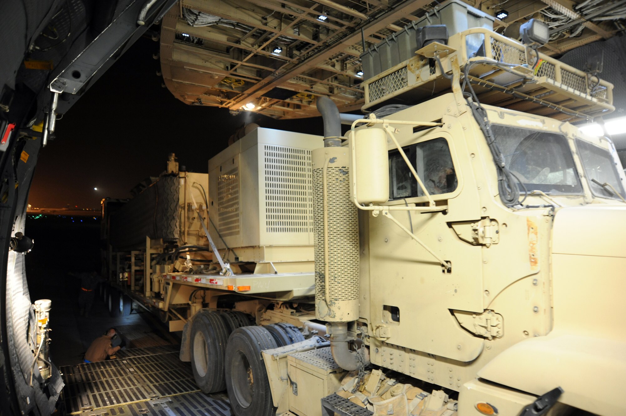 The 87,000 pound Granutech Mobile Rotogrind Shredder Model 525 HP is slowly rolled into an Air Mobility Command C-5M Super Galaxy based out of Dover Air Force Base, Del., May 8, 2013 at an undisclosed airfield, Southwest Asia. (U.S. Air Force photo/Senior Master Sgt. George Thompson)