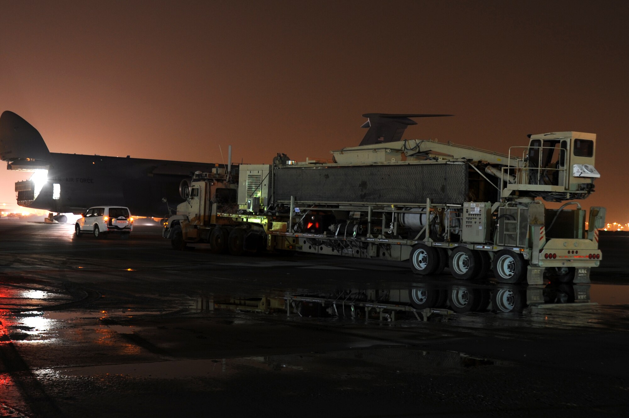 An Air Mobility Command C-5M Super Galaxy waits to be loaded with the 87,000 pound Granutech Mobile Rotogrind Shredder Model 525 HP May 8, 2013 at an undisclosed airfield, Southwest Asia. (U.S. Air Force photo/Senior Master Sgt. George Thompson)