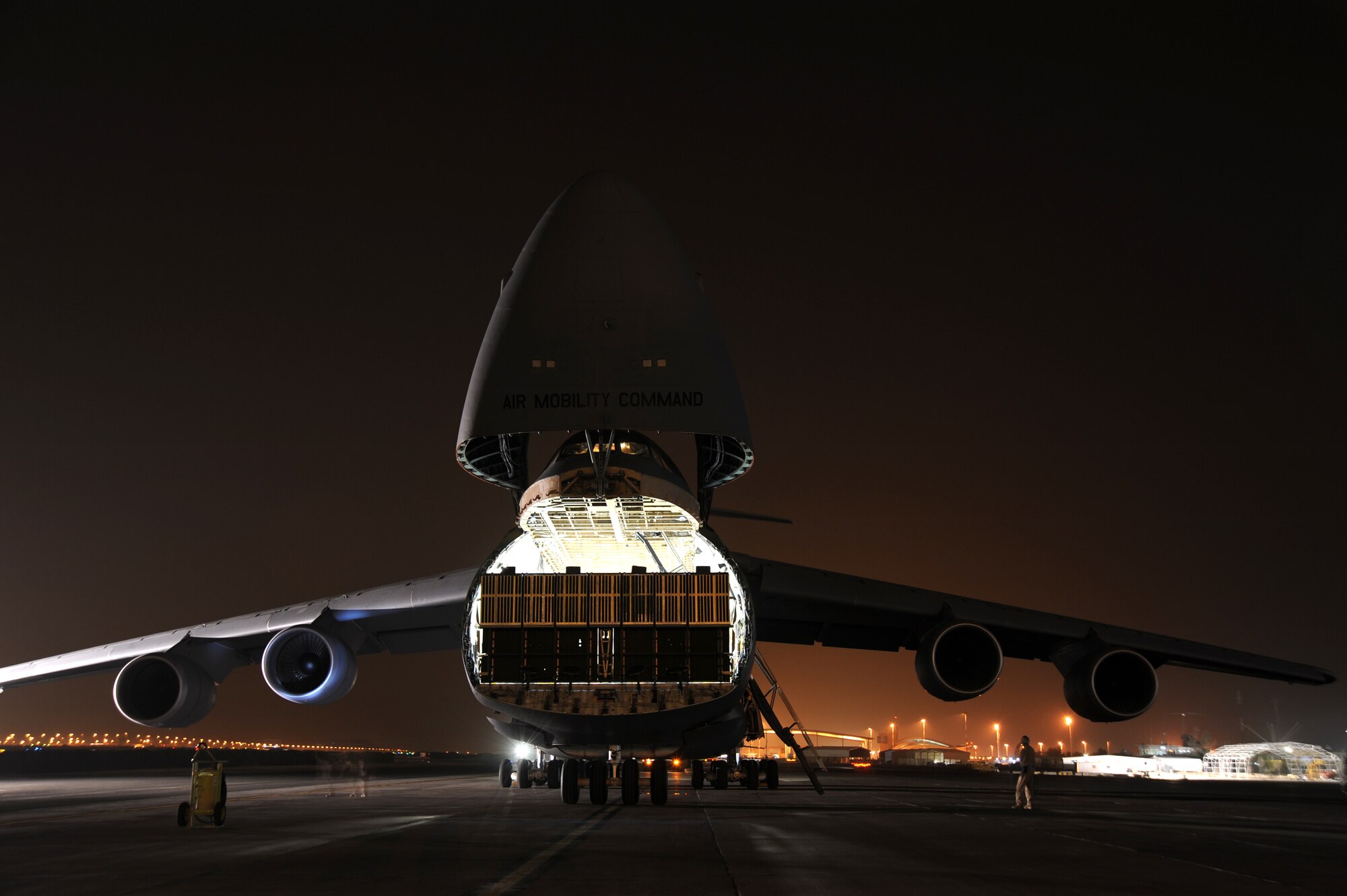 An Air Mobility Command C-5M Super Galaxy waits to be loaded with the 87,000 pound Granutech Mobile Rotogrind Shredder Model 525 HP May 8, 2013 at an undisclosed airfield, Southwest Asia. (U.S. Air Force photo/Senior Master Sgt. George Thompson)