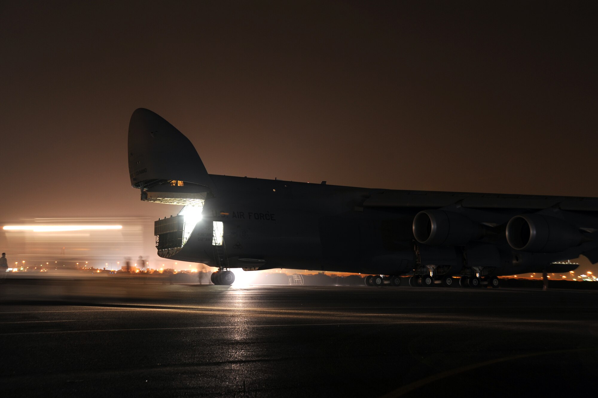 An Air Mobility Command C-5M Super Galaxy waits to be loaded with the 87,000 pound Granutech Mobile Rotogrind Shredder Model 525 HP May 8, 2013 at an undisclosed airfield, Southwest Asia. (U.S. Air Force photo/Senior Master Sgt. George Thompson)