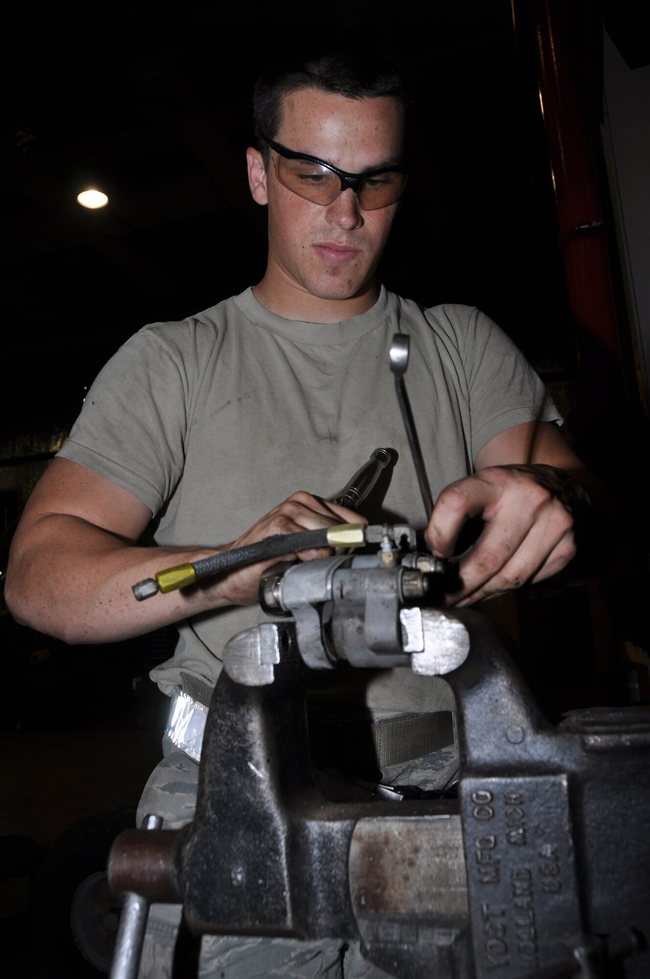 U.S. Air Force Airman 1st Class Stephen Zeiler, 380th Expeditionary Maintenance Squadron Aerospace Ground Equipment journeyman, loosens the bolts on an MJ-1B Bomblift brake assembly during a periodic inspection May 8, 2013, here. The AGE flight is known on the flightline for delivering essential equipment to aircraft in support of maintainance actions, but the majority of the Airman in the AGE flight spend their days maintaining the equipment to ensure there is always mission-ready pieces when needed. Zeiler is an Antioch, Calif., native and is deployed from Elmendorf Air Force Base, Alaska. (U.S. Air Force photo by Staff Sgt. Timothy Boyer)