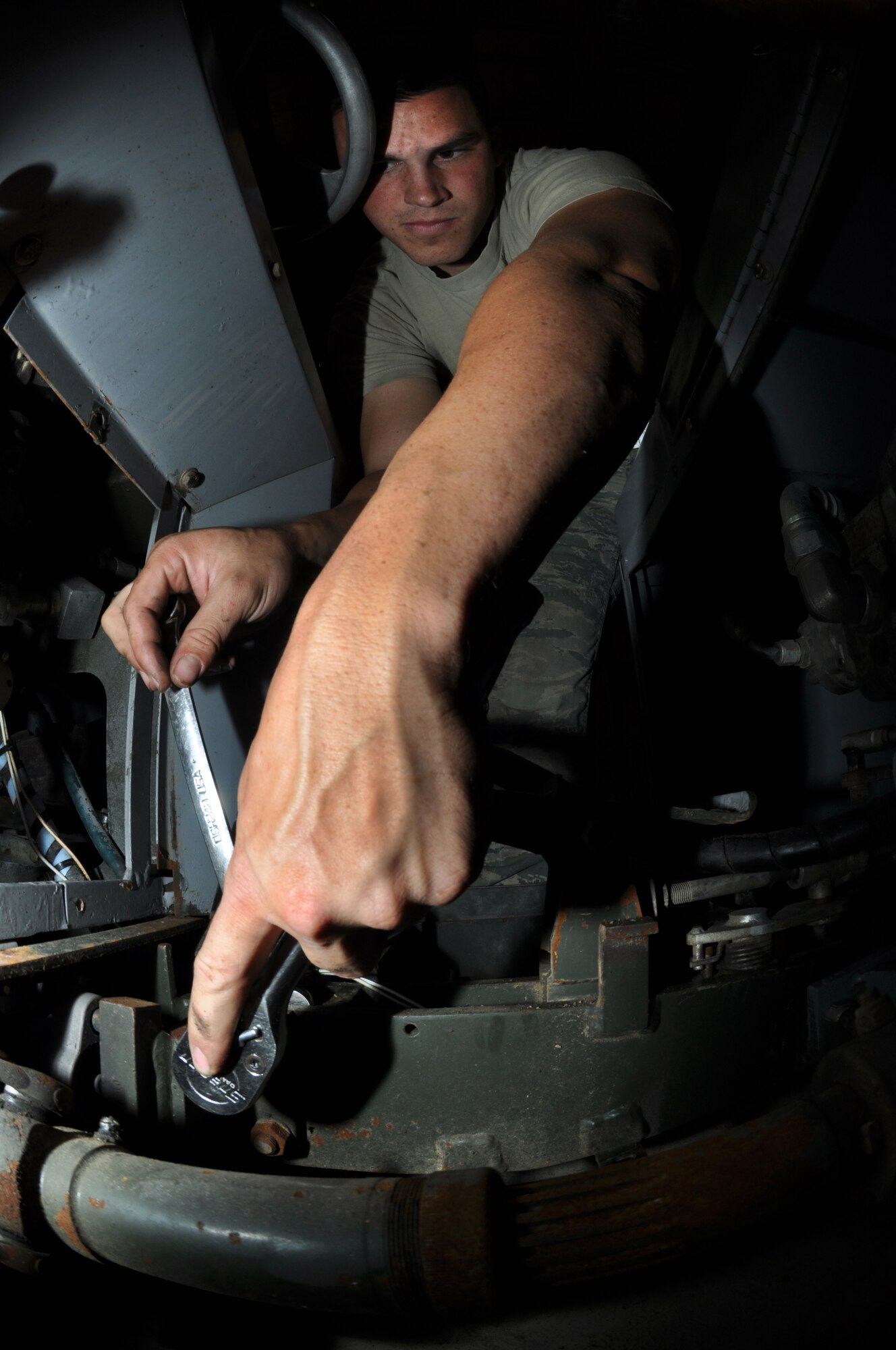 U.S. Air Force Airman 1st Class Stephen Zeiler, 380th Expeditionary Maintenance Squadron Aerospace Ground Equipment journeyman, loosens a bolt on an MJ-1B Bomblift May 8, 2013, during a periodic inspection here. Periodic inspections are "tune-ups" for the equipment, enabling the delivery of more than 7,000 pieces of AGE to aircraft on the flightline monthly. Zeiler is a native of Antioch, Calif., and is deployed from Elmendorf Air Force Base, Alaska. (U.S. Air Force photo by Staff Sgt. Timothy Boyer)