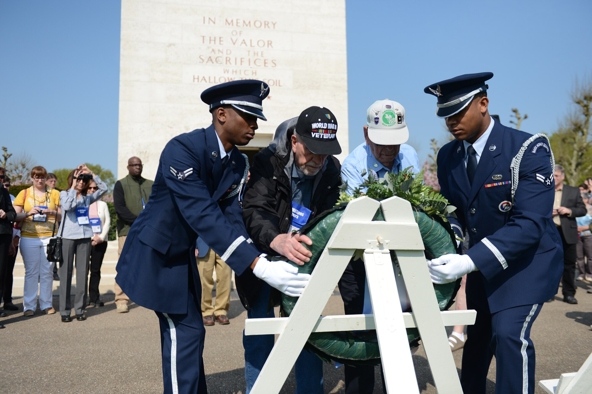 SPANGDAHLEM AIR BASE, Germany – World War II veterans and members of the Spangdahlem honor guard display a wreath during a memorial ceremony at the Margraten American Cemetery in the Netherlands May 6, 2013. The Spangdahlem AB honor guard team travel across Europe to Belgium, the Netherlands, Luxembourg, Poland, Denmark, and northern Germany to participate in similar ceremonies. (U.S. Air Force photo by Airman 1st Class Gustavo Castillo/Released)