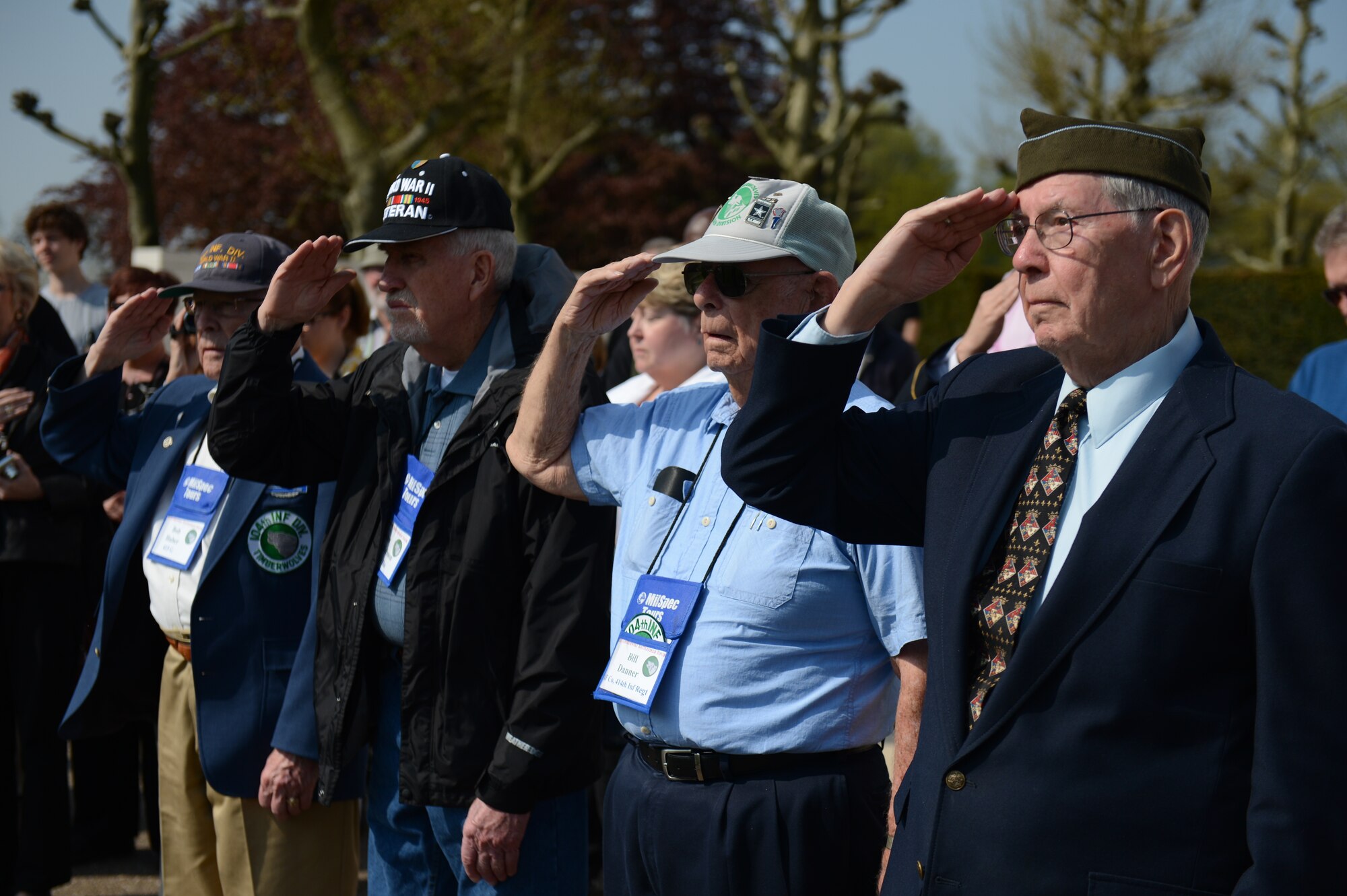 SPANGDAHLEM AIR BASE, Germany – World War II veterans salute during a memorial ceremony at the Margraten American Cemetery in the Netherlands May 6, 2013. The veterans were accompanying a tour that brought both veterans and veteran families to various resting places along the German border. (U.S. Air Force photo by Airman 1st Class Gustavo Castillo/Released)