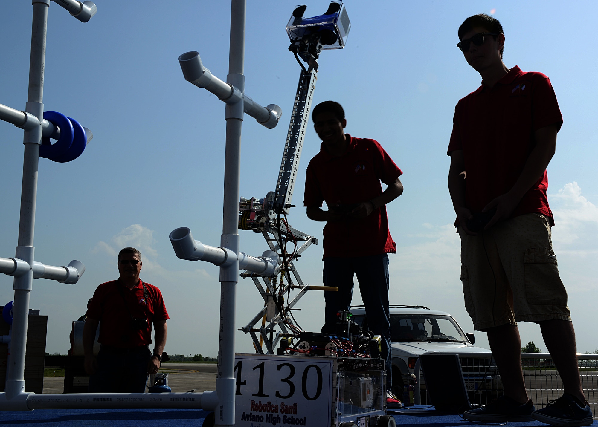 Members of the Aviano Robotics Team control Robotica Santi during a demonstration at Aviano Air Base, Italy, May 4. In there first year of competing,  the Aviano Robotics Team won the regional competition in Germany, and went on to compete in the world championship in St. Lois April 23-27.(U.S. Air Force photo/Staff Sgt. Ryan Whitney)