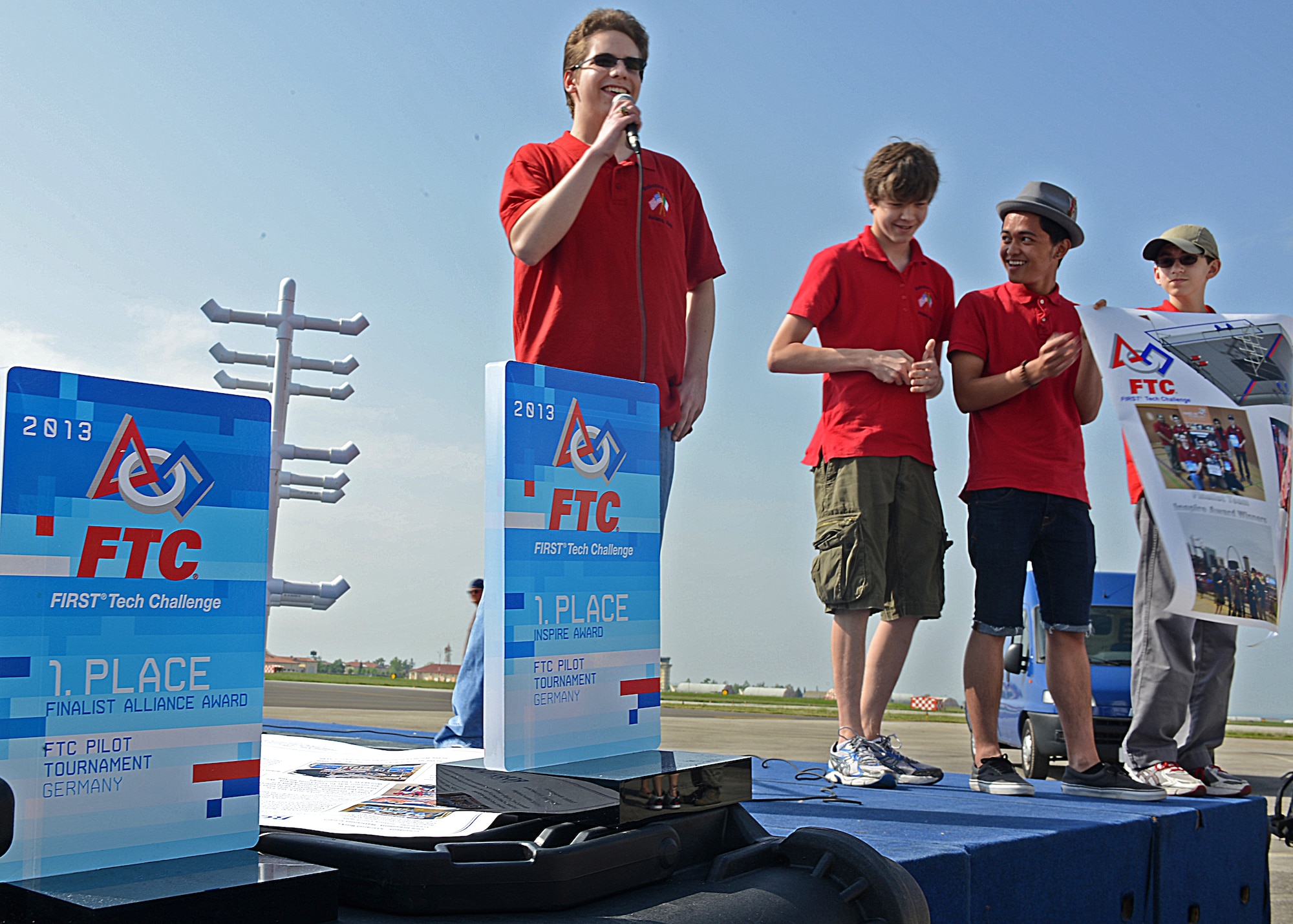 Members of the Aviano Robotics Team introduce themselves prior to a demonstration at Aviano Air Base, Italy, May 4. In there first year of competing,  the Aviano Robotics Team won the regional competition in Germany, and went on to compete in the world championship in St. Lois April 23-27.(U.S. Air Force photo/Staff Sgt. Ryan Whitney)