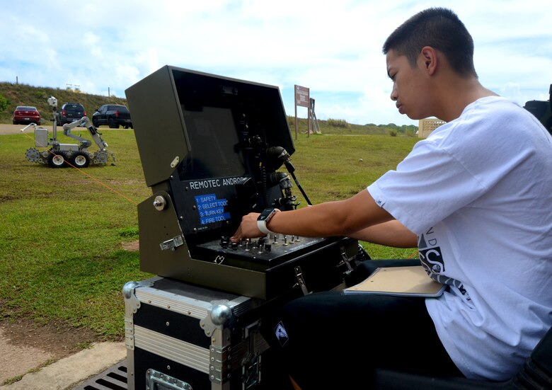 A George Washington High School student operates a F6A explosive ordnance disposal robot at the EOD complex on Andersen Air Force Base, Guam, May 1, 2013. Forty-Three students took a field trip to the complex as part of their current history curriculum in World War II history and the Pacific Islands. (U.S. Air Force photo by Staff Sgt. Benjamin Wiseman/Released)