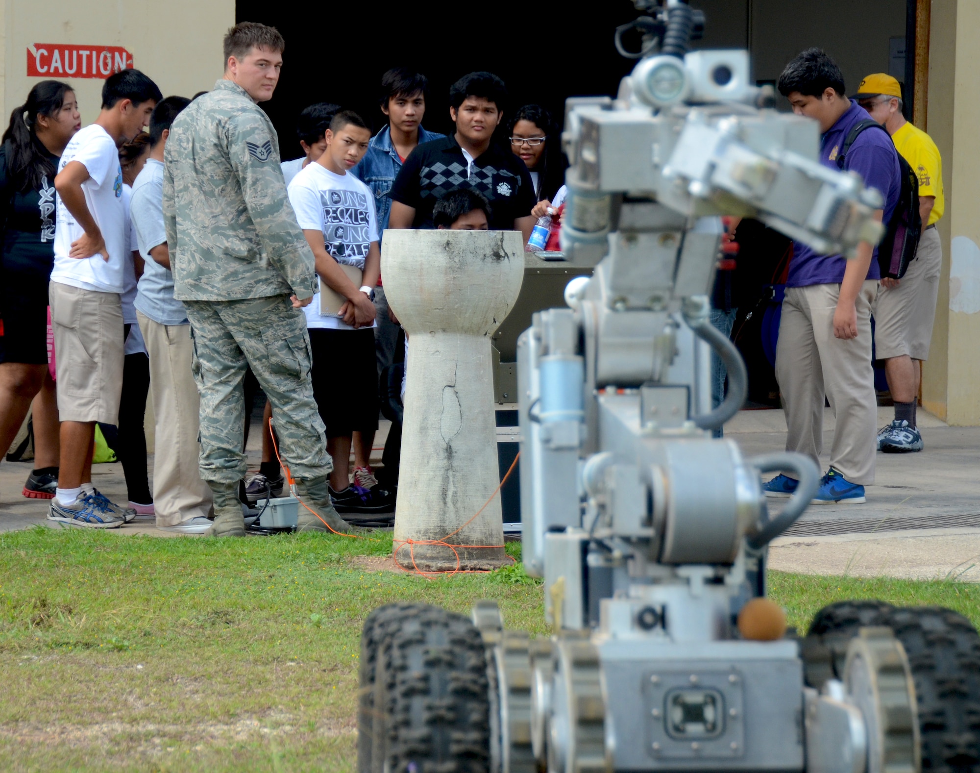 George Washington High School students take turns operating a F6A explosive ordnance disposal robot during a field trip to the EOD complex on Andersen Air Force Base, Guam, May 1, 2013. Forty-Three students took a field trip to the complex as part of their current history curriculum in World War II history and the Pacific Islands. (U.S. Air Force photo by Staff Sgt. Benjamin Wiseman/Released)