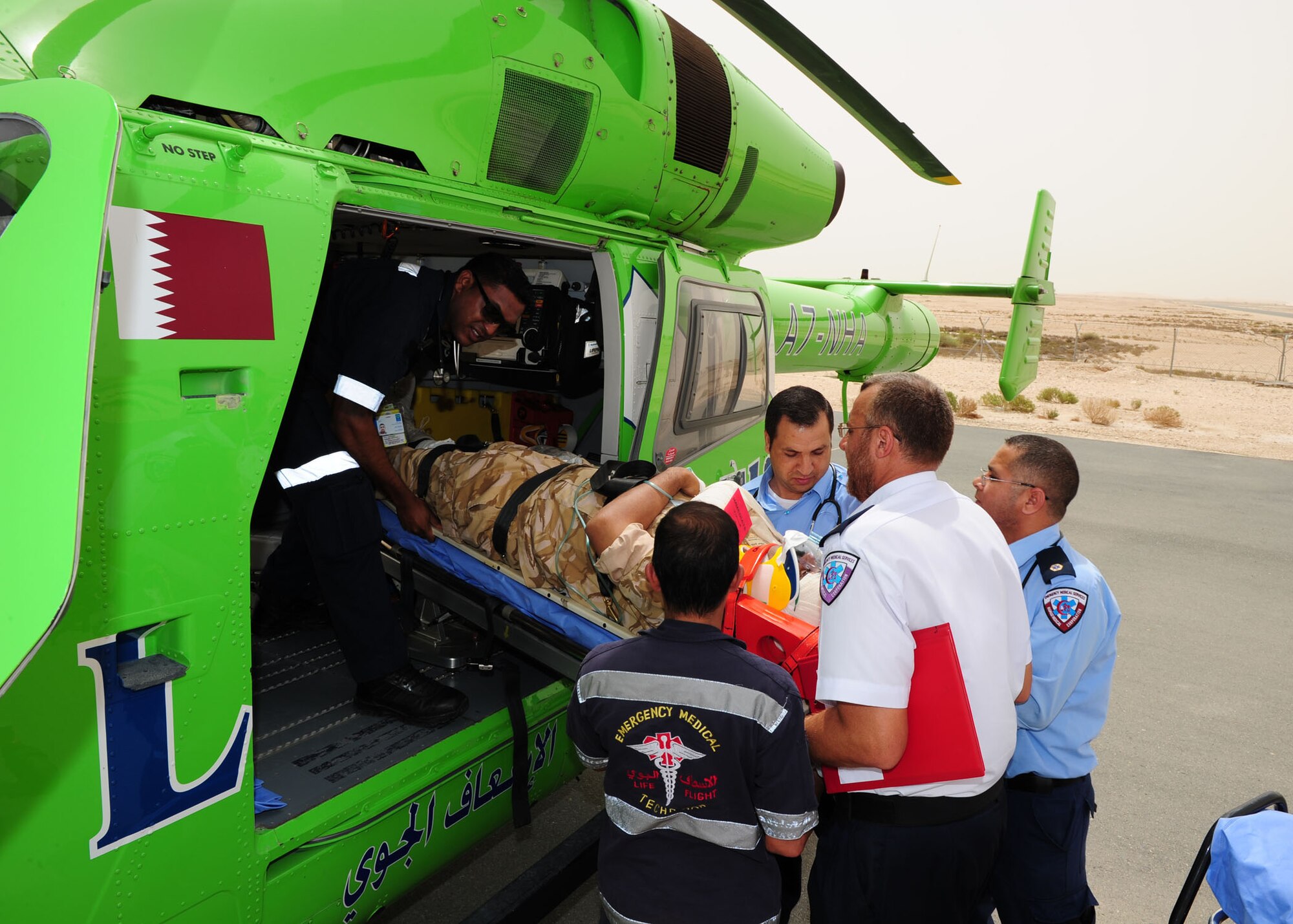 SOUTHWEST ASIA -- Host nation emergency personnel load a simulated critical care patient onto a life-flight helicopter for immediate evacuation during the first joint host nation and U.S. major accident response exercise here May 6. The MARE showcased how host nation and U.S. military work together in an emergency response event.  (U.S. Air Force photo/Master Sgt Brendan Kavanaugh)