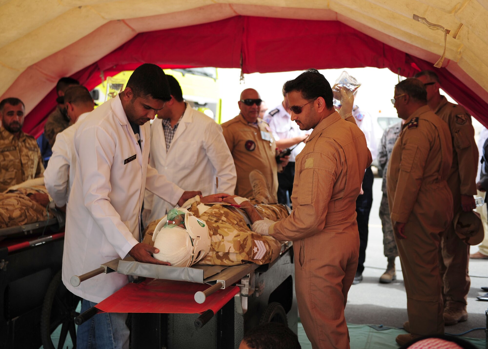 SOUTHWEST ASIA -- Host nation emergency personnel care for a simulated critical care patient during the first joint host nation and U.S. major accident response exercise here May 6. The MARE showcased how host nation and U.S. military work together in an emergency response event.  (U.S. Air Force photo/Master Sgt Brendan Kavanaugh)