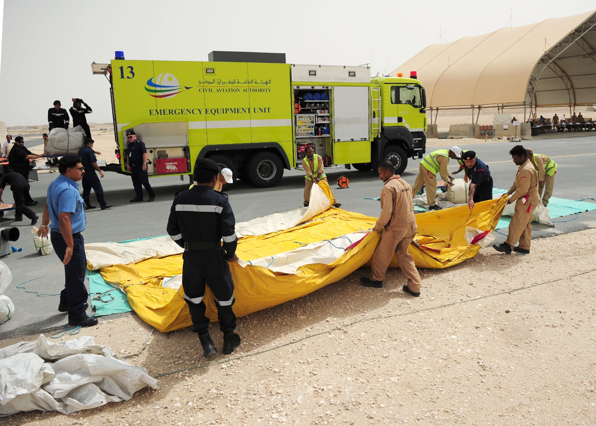 SOUTHWEST ASIA -- Host nation emergency personnel unload and assemble emergency triage tents during the first joint host nation and U.S. major accident response exercise here May 6. The MARE showcased how host nation and U.S. military work together in an emergency response event.  (U.S. Air Force photo/Master Sgt Brendan Kavanaugh)