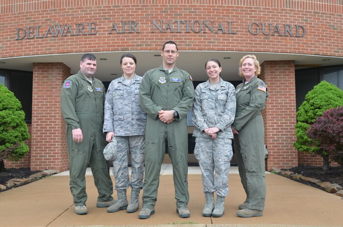 Five Airmen from the 142nd Aeromedical Evacuation Squadron gather upon their return to the New Castle Air National Guard Base on May 8, 2013. The flight nurses and medical technicians from the Delaware Air Guard 166th Airlift Wing completed a four-month overseas mission that began over the holidays. They left Delaware in late December and started operations in Southwest Asia on New Year’s Day in support of Operation Enduring Freedom, providing medical care in the air to America’s wounded combat troops on their way home for further treatment. Additional Airmen from the 142nd AES are still serving in SWA. L to R: Staff Sgt. Michael McBride, Senior Airman Elizabeth Schirling, 1st Lt. Sean Kelley, Senior Airman Samantha Power and Capt. Anne Cloud. (U.S. Air National Guard photo by Tech. Sgt. Benjamin Matwey)