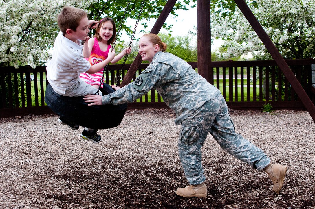 Illinois Army National Guard Sgt. 1st Class Sarah J. Campbell with her children in Rochester, Ill., May 6, 2013. U.S. Army photo by Sgt. Jesse Houk
